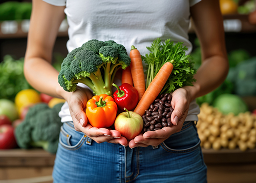 girl holding vegetables in here hand for gut health